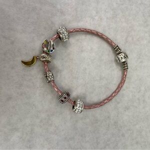 Pink braided leather Authentic Pandora Charm Bracelet with 6 Charms.